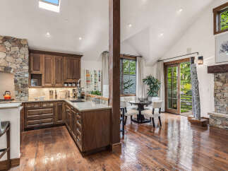 This stunning kitchen boasts a seamless blend of rustic charm and modern elegance.