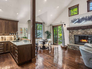 Experience luxury living in this stunning property, featuring a gourmet kitchen with custom cabinetry and a spacious island.