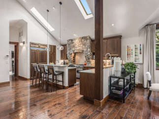 This stunning kitchen boasts a rustic yet modern design, perfect for culinary enthusiasts.