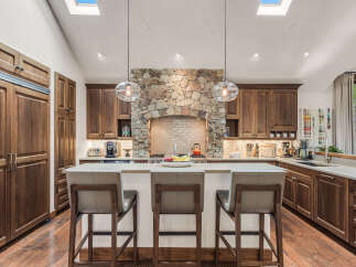This stunning kitchen boasts a warm and inviting atmosphere, perfect for culinary creations and entertaining.