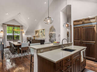 This stunning kitchen boasts a modern design with high-end appliances and ample counter space, perfect for culinary enthusiasts.