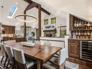 This stunning dining room showcases a modern design with a touch of rustic charm.