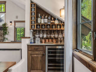 This stunning home features a custom-built bar area, perfect for entertaining guests.
