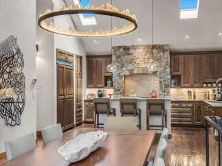 Step into luxury with this stunning kitchen and dining area.
