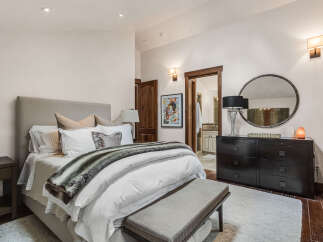 This luxurious bedroom showcases a blend of comfort and elegance.