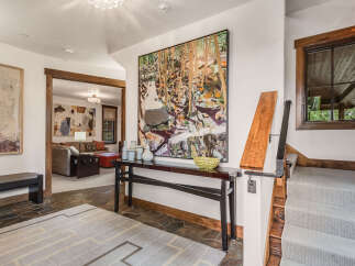 Step into luxury with this stunning entryway, showcasing a captivating blend of modern design and natural elements.