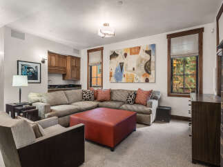 This stunning living room boasts a cozy sectional sofa, perfect for relaxing and entertaining.