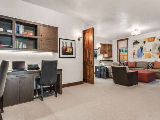 This stunning property boasts a sophisticated home office with custom built-ins, perfect for remote work or creative endeavors.