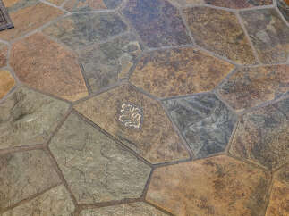 This stunning property boasts a beautifully designed stone floor, adding a touch of elegance and durability.