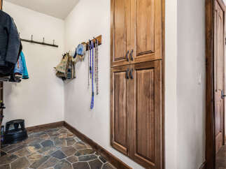 This stunning entryway showcases a beautiful blend of natural elements and functional design.