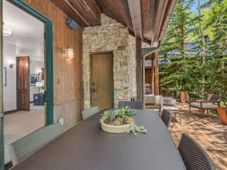 Enjoy outdoor living at its finest with this stunning property featuring a spacious deck and inviting patio area.