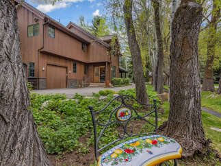 Nestled amidst lush greenery and mature trees, this stunning property offers a serene escape.