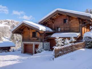 This stunning chalet boasts a classic alpine design, perfect for a luxurious winter getaway.