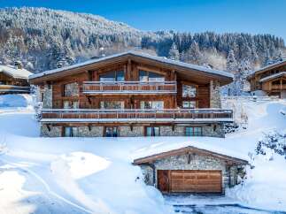 Experience the epitome of luxury living in this stunning chalet nestled amidst a winter wonderland.