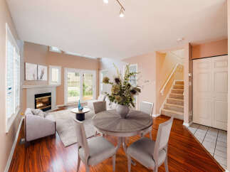 This stunning property boasts a spacious living area with a cozy fireplace, perfect for relaxing evenings.