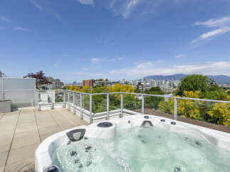 Enjoy breathtaking city views from this luxurious rooftop oasis.