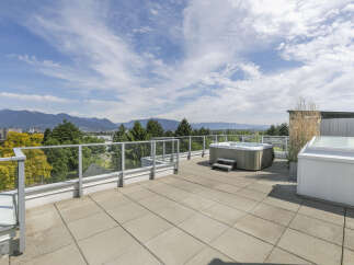 Enjoy breathtaking views from this luxurious rooftop terrace, complete with a hot tub, perfect for relaxation and entertaining.