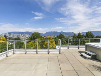 Enjoy breathtaking city and mountain views from this stunning rooftop terrace.