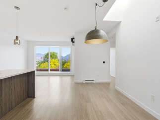 Step into modern elegance with this stunning property, featuring a bright and airy open-concept living space.