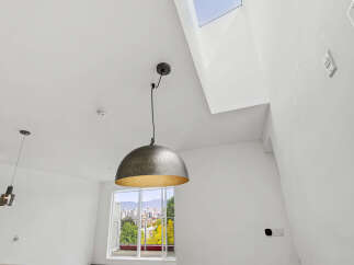 This stunning property boasts a modern design with high ceilings and an abundance of natural light.