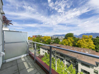 Enjoy stunning city and mountain views from this modern condo's spacious balcony.