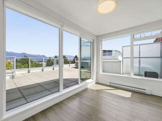 Enjoy breathtaking views from this stunning property featuring expansive windows that flood the space with natural light.