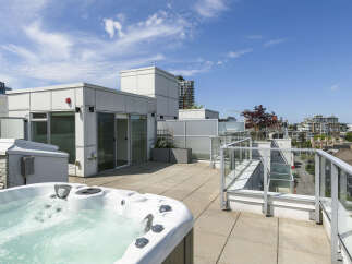 Enjoy luxurious rooftop living with this stunning property featuring a private hot tub and expansive views.