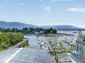 Experience luxury living with breathtaking views of the marina and surrounding mountains.