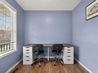 This inviting home office space features a sleek desk setup, perfect for productivity.