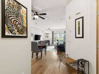 Step into this inviting home featuring a vibrant zebra artwork that adds a touch of personality to the entryway.