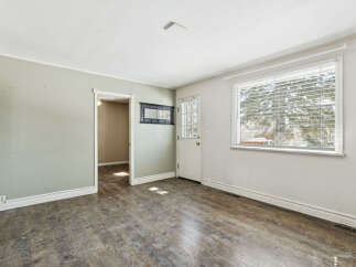Step into this inviting space, featuring a blend of natural light and functional design.