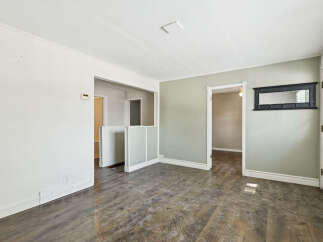Step into this inviting space, featuring a neutral color palette and ample natural light.
