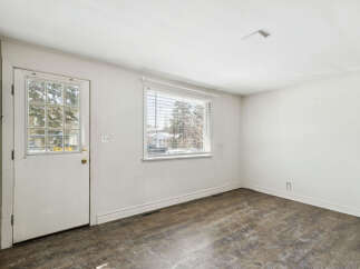 Step into this inviting space, featuring a bright and airy interior with ample natural light.