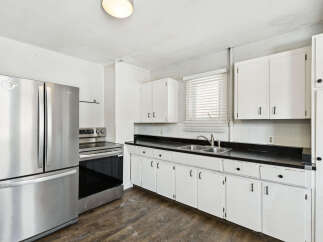 This charming kitchen boasts a bright and airy atmosphere, perfect for culinary adventures.