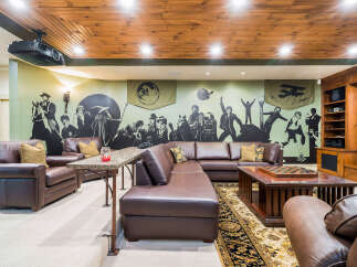 Step into luxury and entertainment in this stunning home theater! Featuring a custom-designed space with comfortable leather seating, a large screen, and a state-of-the-art sound system, perfect for movie nights or game days.