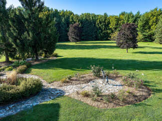 This stunning property boasts a beautifully manicured lawn, perfect for outdoor activities and relaxation.