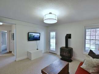 This cozy living space features a modern fireplace, perfect for creating a warm and inviting atmosphere.