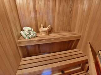Step into your own private oasis with this luxurious sauna.