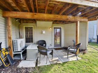 Enjoy outdoor living in this charming covered patio space.