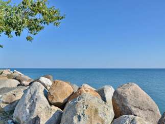 Enjoy breathtaking views of the serene lake from this stunning property.