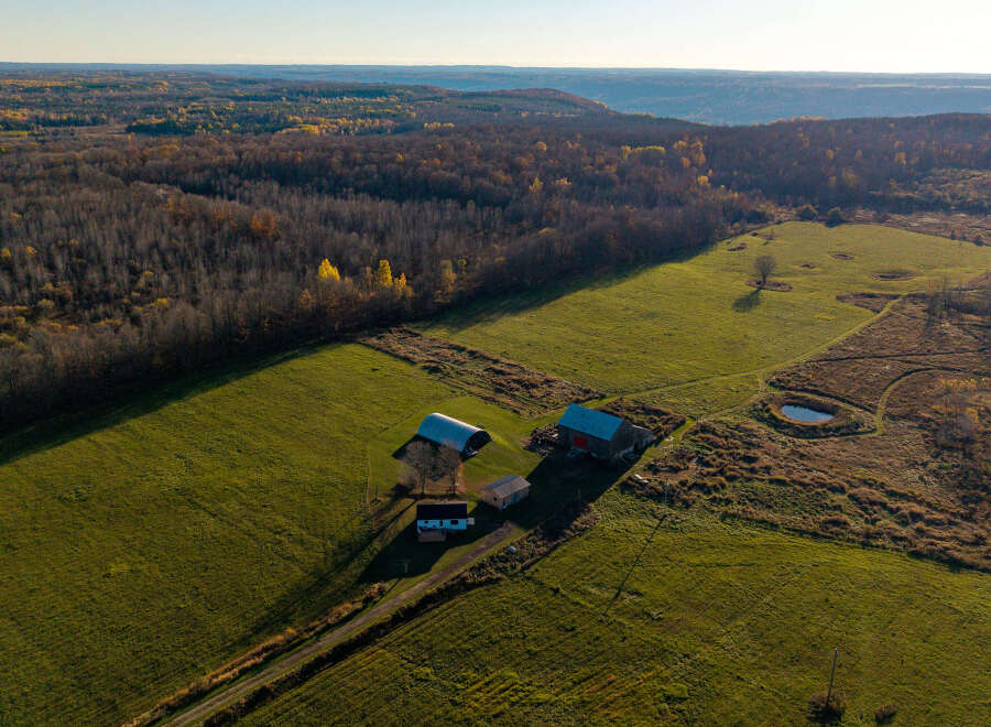 Discover this charming rural property featuring a classic barn and a cozy home, perfect for those seeking a peaceful countryside lifestyle.