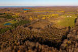 Discover this stunning aerial view of a sprawling rural landscape, perfect for those seeking tranquility and nature.