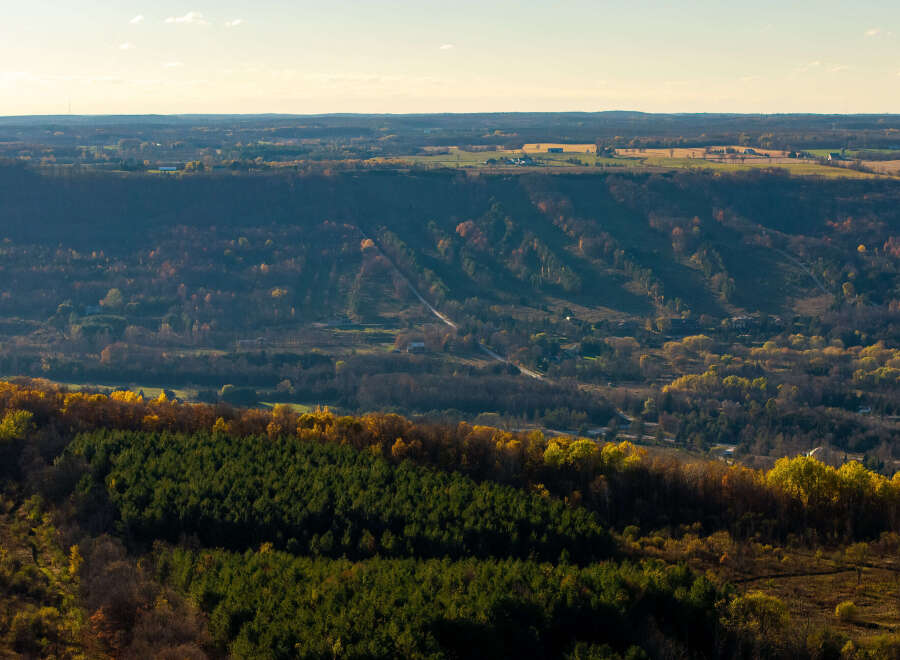 Experience breathtaking panoramic views from this stunning property, nestled amidst rolling hills and vibrant autumn foliage.