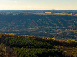 Experience breathtaking panoramic views from this stunning property, nestled amidst rolling hills and vibrant autumn foliage.