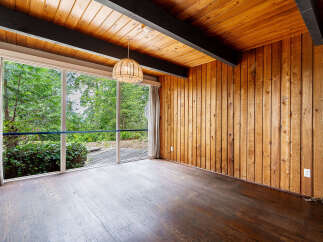 This stunning property boasts a unique blend of natural elements and modern design.
