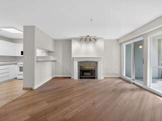 This stunning property boasts a spacious living area with beautiful hardwood floors and a cozy fireplace, perfect for relaxing evenings.