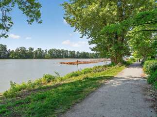 Enjoy scenic views and peaceful walks along the river in this stunning location.