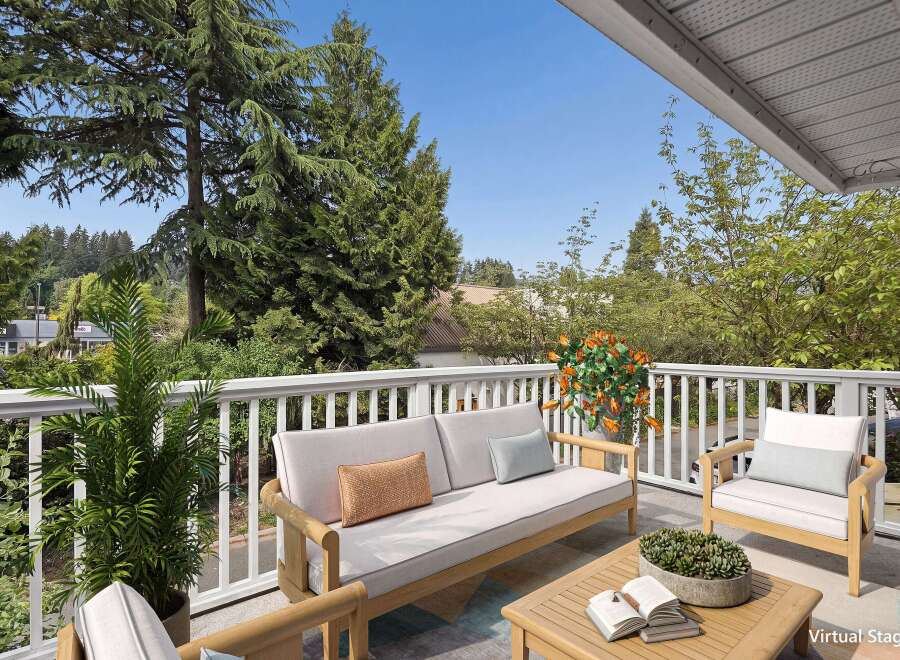 Enjoy the outdoors from this charming balcony, perfect for relaxing or entertaining.
