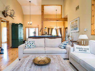 This stunning living room boasts a cozy and inviting atmosphere, perfect for relaxation and entertaining.