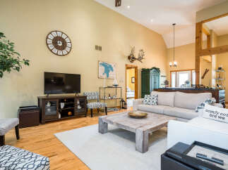 Step into this inviting living space, showcasing a blend of rustic charm and modern comfort.